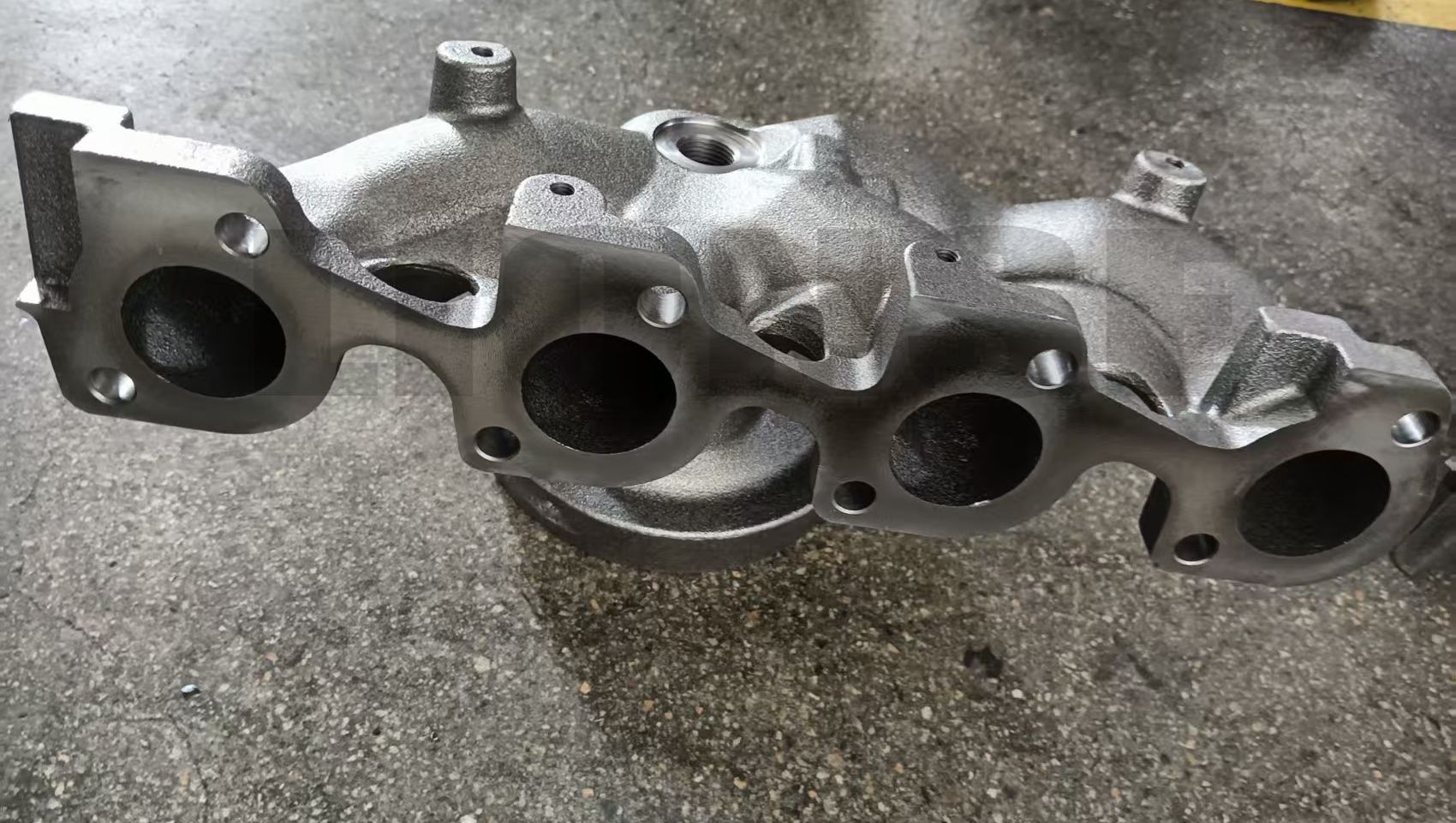 Apa keuntungan pengecoran manifold buang?